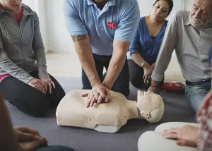 Performing chest compressions on a CPR dummy